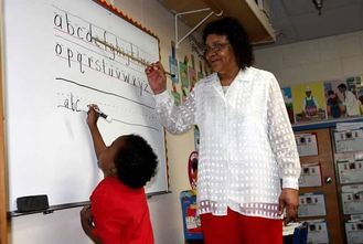 Picture of Foster Grandparent volunteer working with student